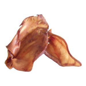 Close-up of large Grade A pig ears dog treats, showing their natural, slightly rough texture.